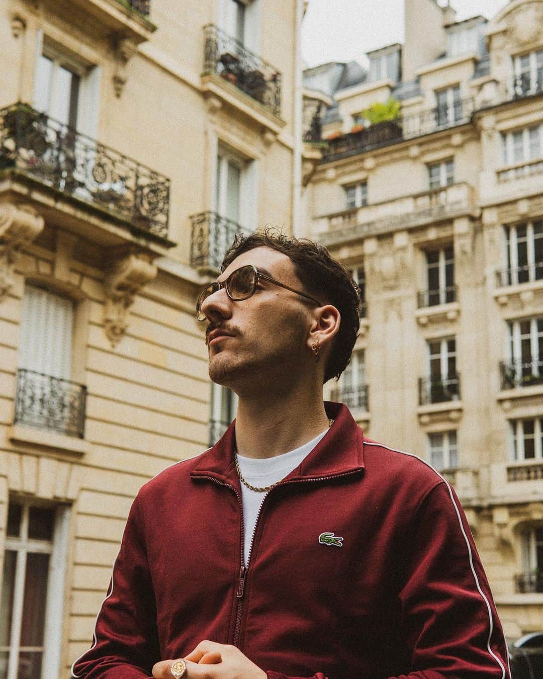 のインスタグラム：「@raska_yt takes the iconic Lacoste Paris Tracksuit for a spin in the heart of the city of light. ✨🇫🇷 #MyLacosteTracksuit  📸 @mobiusvisio」