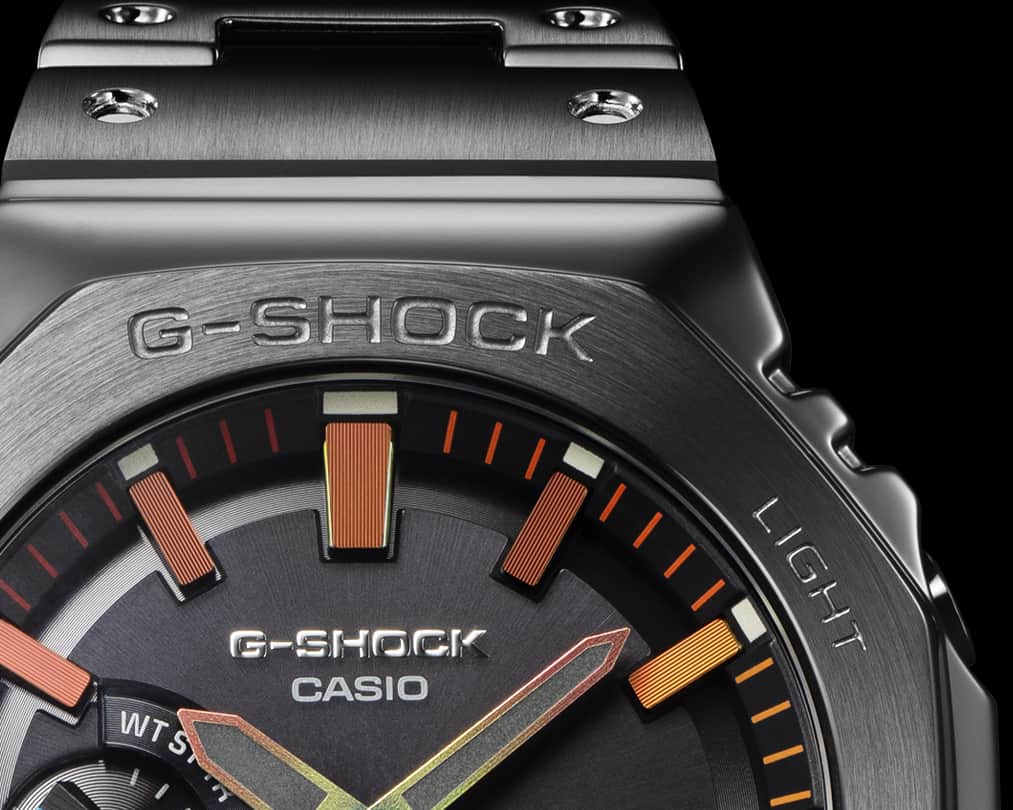 G-SHOCKのインスタグラム：「FULL METAL  オールブラックのルックスになじむ暖色系のカラーリングで、内面からにじみ出る強さと美しさを表現したGM-B2100BPC。そして、シルバー外装とブラックダイアルを組み合わせ、パープルとブルーのグラデーションを配色したGM-B2100PC。  GM-B2100BPC with warm hues that nicely complement the otherwise all-black color scheme, the design expresses the strength and beauty of a spirit all your own, a spirit that comes from within. GM-B2100PC’s silver-colored exterior is combined with a black dial, while the index marks and hour and minute hands are adorned with purple/blue color gradation.  GM-B2100BPC-1AJF  GM-B2100PC-1AJF  #g_shock #gmb2100 #fullmetal #metal #rainbow #fashion #watchoftheday #腕時計 #腕時計魂 #腕時計くら部 #今日の腕時計 #腕時計コーデ」
