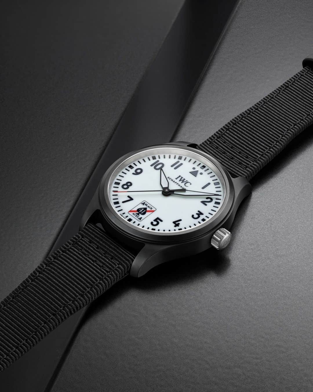 IWCのインスタグラム：「The Pilot's Watch Automatic 41 Black Aces features a soft-iron inner case for protection against magnetic fields and a glass secured against displacement by drop in air pressure.  🔗Link in Bio  ℹ White dial Ceramic case 41mm Black textile strap Ref. IW326905  #IWCpilot | #IWCwatches」