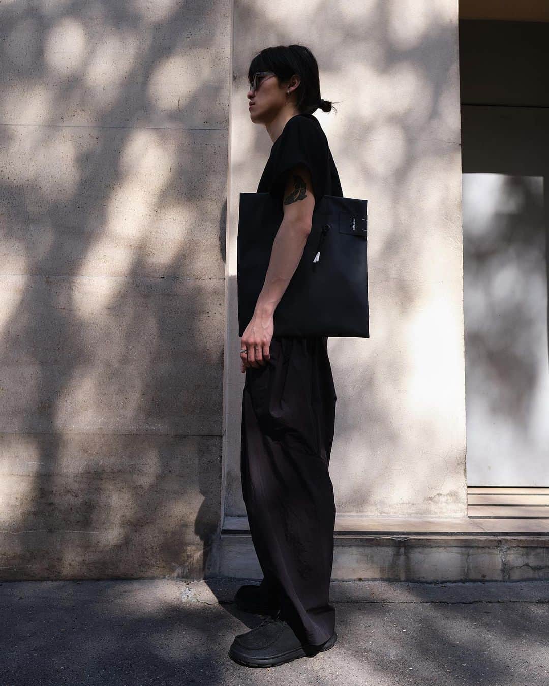 コートエシエルのインスタグラム：「The TODD Tote Bag is a long-standing silhouette that embodies the unique côte&ciel design philosophy by creating volume from one flat surface, reminiscent of origami.   Available now from www.coteetciel.com  Photographer: @graemegaughan」