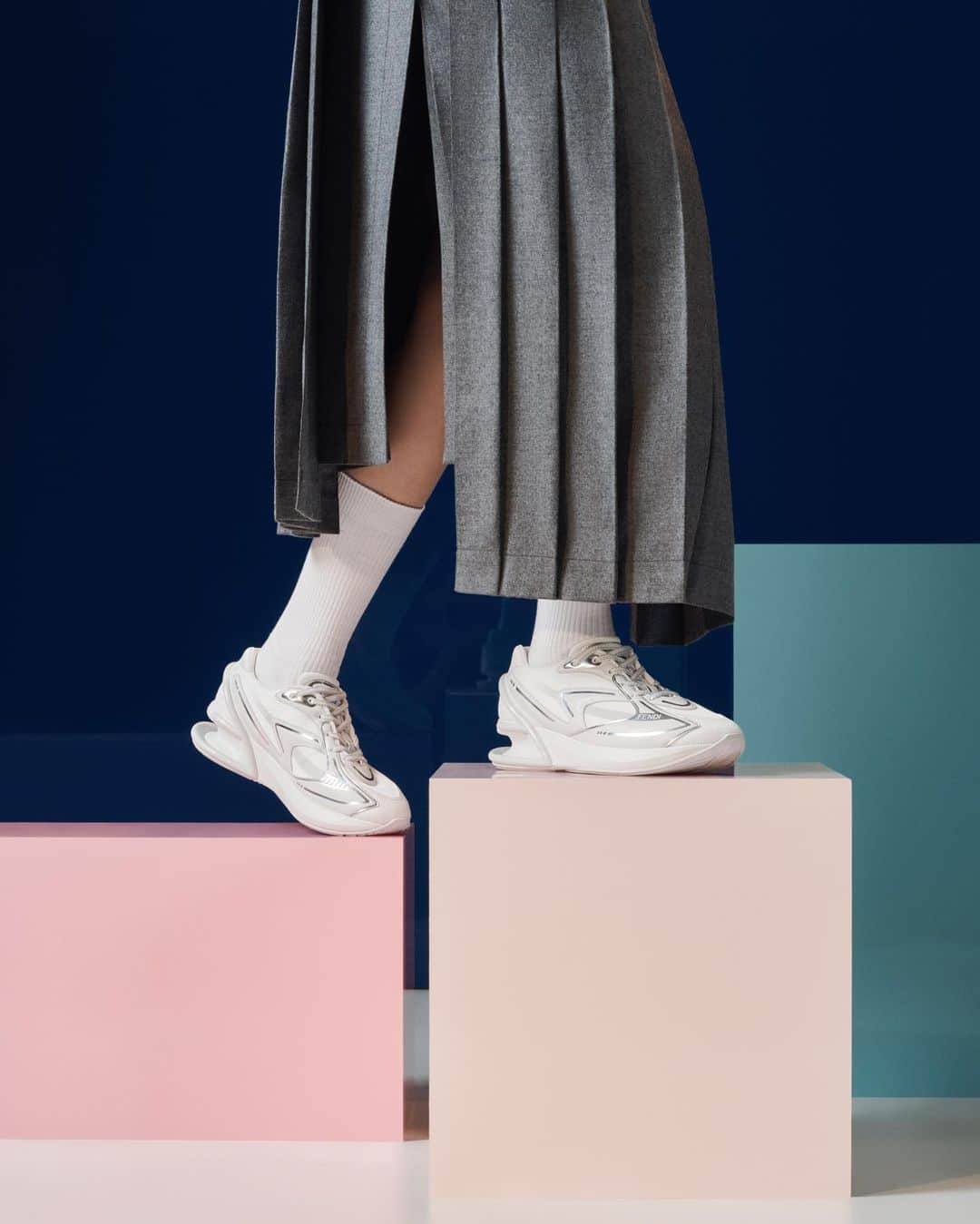 Fendiのインスタグラム：「The First 1 with a heel suspended in air, emblematic of its lightweight design.  Launching worldwide on 5 October, the style is now available exclusively in select locations and at Fendi.com.  Artistic Director of Couture and Womenswear: @mrkimjones  Artistic Director of Accessories and Menswear: @silviaventurinifendi  Artistic Director of Jewellery: @delfinadelettrez   Styling: @elliegracecumming Hair: Shingo Shibata Makeup: Kiki Gilford  Casting: @shelleydurkancasting  Photography: @hannamoon69  Set: @mattjacksonmattjackson」