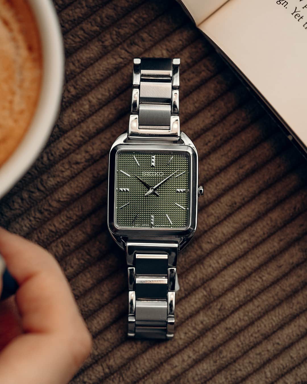 Seiko Watchesのインスタグラム：「Let's Bring Earthy Tones to Your Fall Attire 🍃 - Sophisticate your style  and enhance the season's attire with this streamlined square case and olive green dial with die-stamped pattern.   #SWR075 #Seiko #SeikoEssentials」