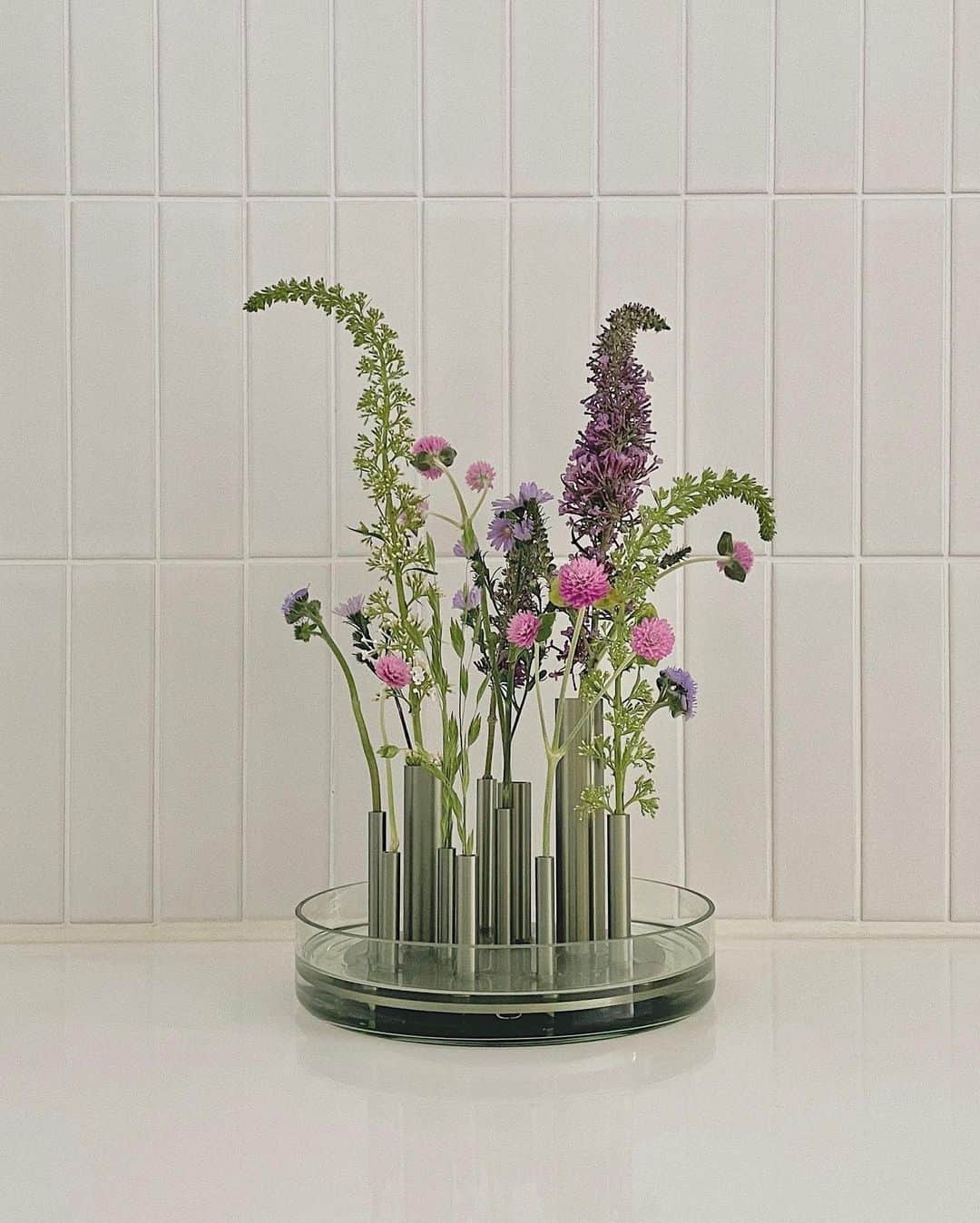 のインスタグラム：「The Ikeru and Ikebana vases designed by Jaime Hayon for Fritz Hansen. Both are inspired by the Japanese art of flower arranging, where every flower is given space to shine, from stem to bloom. ⁠ ⁠ Which vase is more your style? ⁠ ⁠ 1. Ikeru with individual flower-holding flutes ⁠ 2. Ikebana with perforated stem holder⁠ ⁠ Discover the vases via the link in bio. ⁠ ⁠ Credits: @lyun」