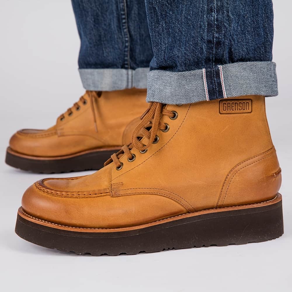 のインスタグラム：「While digging through our 156-year-old archives, we found a whole load of old Grenson logos, some of which you can see on our Rack 20 boots online, but we loved this one in particular so decided to stamp it on a brand new style boot. Here's Asa / Anya in ginger nubuck with a rubber wedge. ⁠ ⁠ ⁠ #grenson #grensonshoes #menswear #mensstyle #womenswear #womensstlye #style #boots #grensonboots」