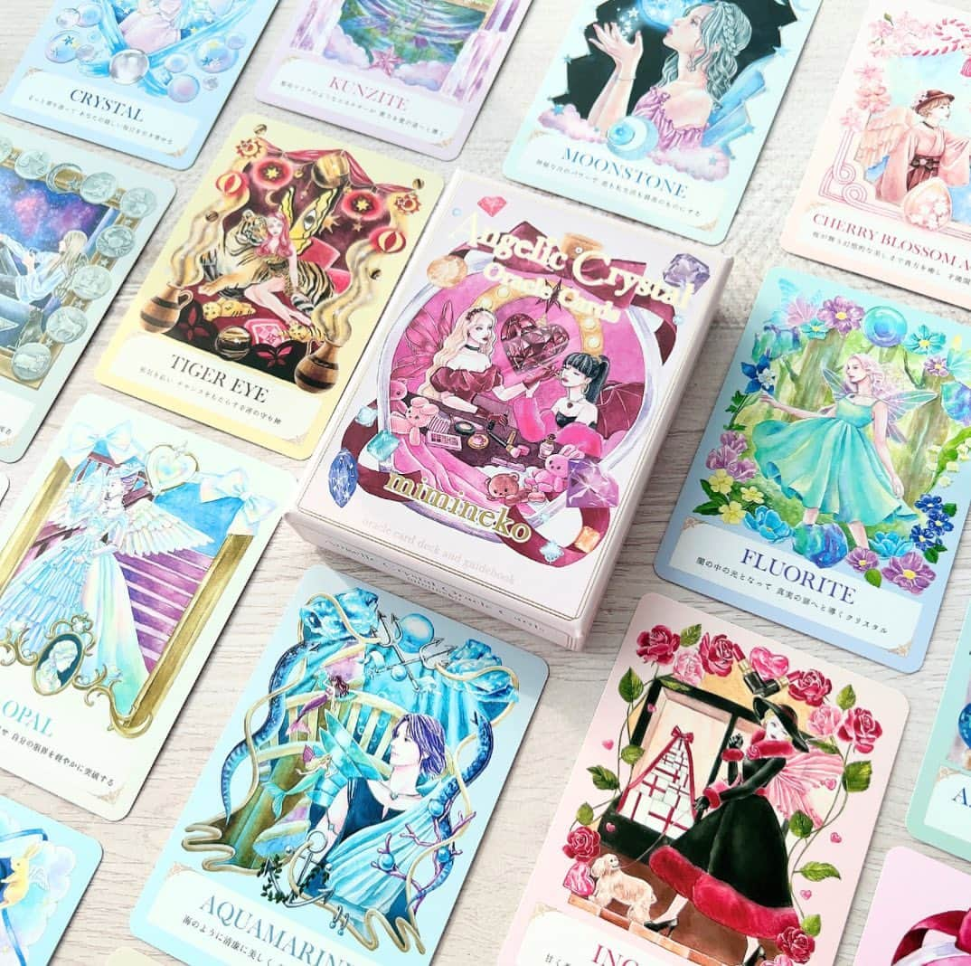 miminekoさんのインスタグラム写真 - (miminekoInstagram)「大変お待たせ致しました🩷 ⁡ Angelic Crystal Oracle Cards、 先日出来上がりました〜！ ⁡ 先週から少しずつ発送を開始し、今週は本格的に発送していきます！ 楽しみにお待ちくださいね💕 ⁡ 紙の質感や、箔押しなど高級感のある仕上がりになりました💎 箱の表紙の色にもこだわり、何度も修正したので、ニュアンスのあるカラーが出てくれました。 ⁡ 皆さんがこのオラクルカードで、自己対話を深めたり、自己愛が高まるきっかけになりましたら幸いです🌹 リーディングでも、様々な占いに対応出来ると思いますので、沢山使用してくださると嬉しいです！ ⁡ オラクルカード制作にあたり、色々大変な事もありました。近いうちに動画で語らせてください🥺❤️ ⁡ ⁡ こちらのオラクルカードは、 ・YouTube動画内 ・YouTubeサムネイル ・SNS などで自由にご使用していただけます！ イラストレーター様にも許可を得ていますので、私にもご連絡不要でご使用可能です♫ （※YouTube、SNS以外の商用利用は出来ません） ⁡ 皆さんのリーディングライフが素敵なものになりますように🩷 ⁡ ⁡ #オラクルカード #タロット #oracle #tarot #占い #カードリーディング」10月2日 13時17分 - mimineko_neko