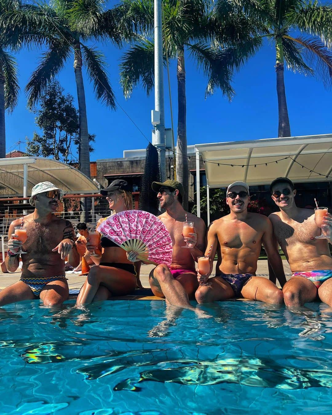 マデリン・グローヴスのインスタグラム：「Afterglow from Big Gay Day, shining even brighter poolside with my fabulous swim squad 🌈✨. Aperol slushies, glitter, and all the gay vibes. #SplashOfPride”」