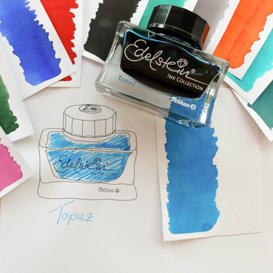 ペリカンのインスタグラム：「Dip your nib in our enchanting Edelstein Ink Topaz! 💙✒️  Topaz as a gemstone has been revered for centuries, symbolizing creativity, inspiration, and clarity of thought. Just like the mesmerizing Topaz, this ink unleashes a wave of imagination.  Have you tried it yet?  💎 Available as a 50 ml ink bottle.  #PelikanPassion #EdelsteinInk」