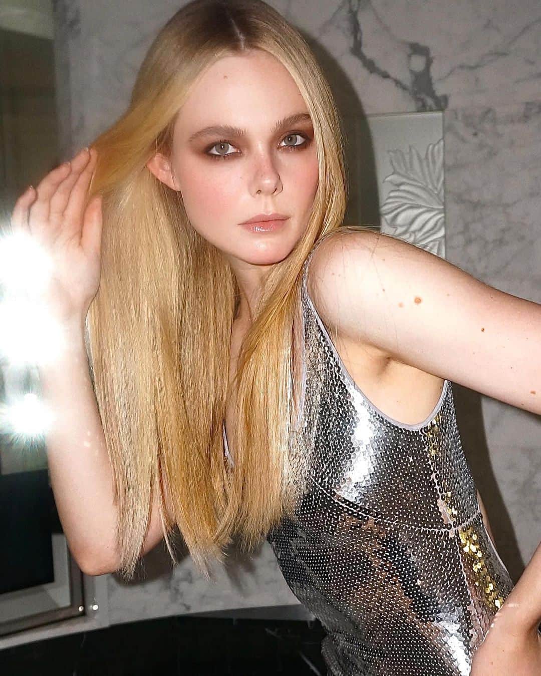エル・ファニングのインスタグラム：「Thanks for the GLAM this week @tyronmachhausen and @owengould 🩶 Both of your photography skills are magazine level good 😆 #hotelbathroom #pfw」