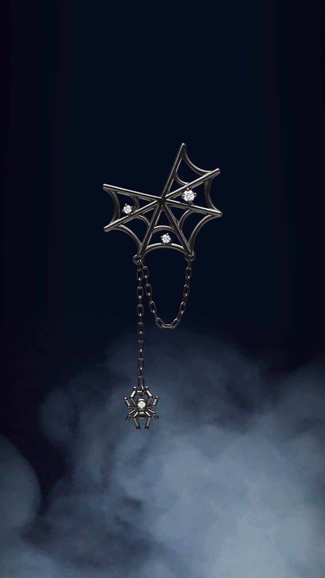 Mikimotoのインスタグラム：「Time to get into the Halloween spirit with themed jewellery like this cobweb pin brooch with a swaying spider charm.   動きに合わせて揺れるクモのチャームが印象的。モチーフジュエリーでハロウィーンムードを盛り上げて。   #MIKIMOTO #ミキモト #MikimotoHalloween #MikimotoHoliday」