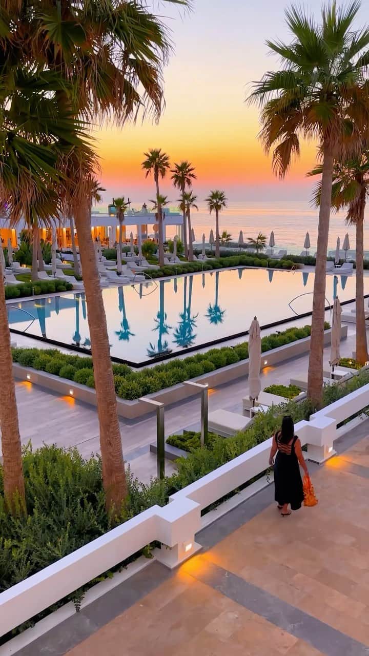 BEAUTIFUL HOTELSのインスタグラム：「@takemyhearteverywhere savors the beauty of Grecotel Lux Me White Palace in the captivating Crete, Greece! 🇬🇷🌴 A heavenly retreat where luxury meets the crystal-clear waters of the Mediterranean, and magical sunsets like this are served up in the evenings. 😍   📽 @takemyhearteverywhere 📍 @grecotelwhitepalace, Crete, Greece 🎶 Lana Del Rey - Say Yes To Heaven」