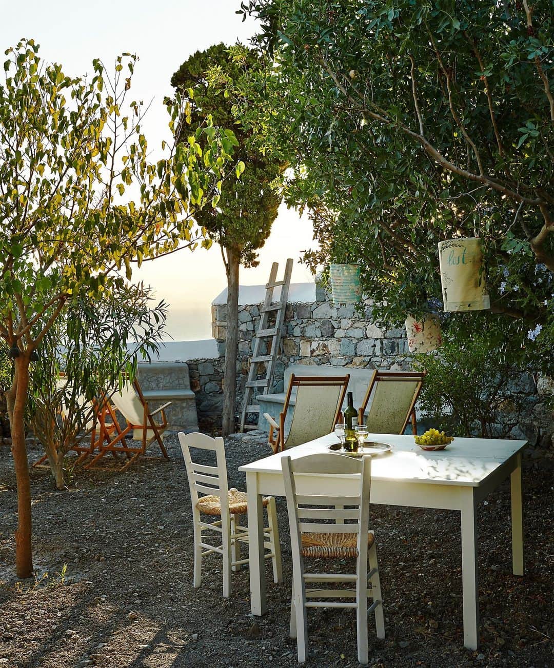ELLE DECORのインスタグラム：「It may have been more than 20 years ago, but the owner of this house on Patmos recalls her first trip to the Greek island in vivid detail. A Paris-based fashion executive, she had arrived by boat at 3 a.m. to discover the resort still in full nightlife swing. “There was lots of activity,” she remembers. “I wondered just where I’d landed.” She quickly fell in love with Patmos—the rocky landscape, the sunny climate— and purchased a rustic home there fashioned from a 17th-century stable that had been in ruins. This outdoor table, made by a local carpenter, is the perfect spot to soak in the isle’s magical light—“white in the morning, purple and pink in the evening,” she says.  Click the link in bio to tour the rest of this tranquil retreat, as seen in the ELLE DECOR archive. Written by @iangphillips. Produced by @therobertrufino. Photographed by @bjornwallander.」