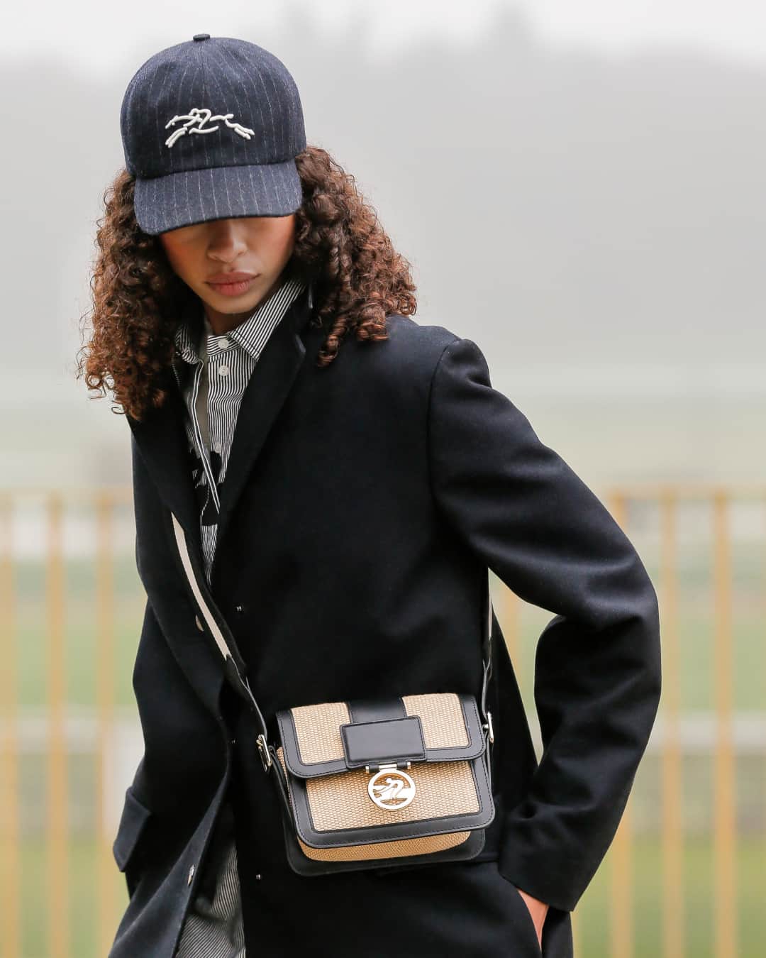 Longchampのインスタグラム：「How do you carry it? Slung over the shoulder.  Collection: #LongchampFW23 Bag: #LongchampBoxTrot Ready-to-wear: @longchamp  Photographer: @eddiewrey Casting: @julialangecasting Hair stylist: Pierre Saint-Sever Make-up artist: @helenevasnier Model: @zoethaets  #longchamp #newcollection #backtoshcool #longchampgirls #ootd #outfit #horseracing #leather #classic #shoulderbag #frenchy」