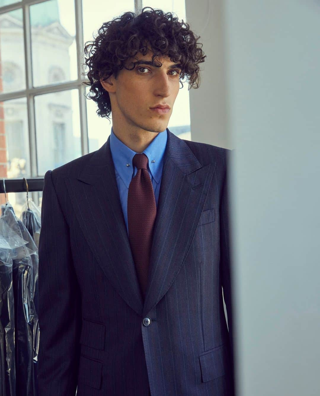 エドワード セクストンのインスタグラム：「It can’t be an Edward Sexton collection without a nod to the past. This suit, made in a striking navy, burgundy and grey multi-stripe screams retro, and the classic Sexton cut gives it the edge that makes it that much more special. Explore the full #AW23 collection now, online at edwardsexton.co.uk or in-store at 35 Savile Row.⁠ ⁠ #edwardsexton #savilerow #menswear #london #tailoring #sartorial #aw23 #autumn #winter」