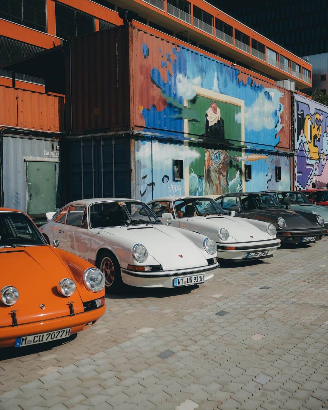 Porscheのインスタグラム：「Porsche & Coffee – 911 style 🧡  This weekend, our Porsche community gathered in Munich to celebrate six decades of the 911. Together they assembled a line-up that paid fitting tribute across its 60 years. Up next? Taking these cars on a special road trip. Stay tuned! 🏔️」