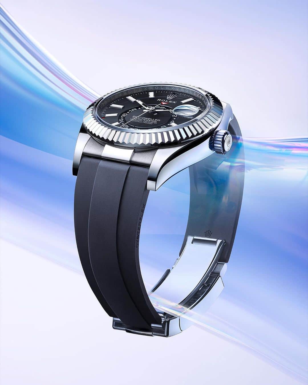 rolexのインスタグラム：「The Sky-Dweller in 18ct white gold, featuring a bright black dial and an Oysterflex bracelet. It is fitted with the Rolex Glidelock extension system, designed to enable the wearer to easily adjust the bracelet while on the move for optimum comfort. At Rolex, simplicity is paramount. #Rolex #SkyDweller #Perpetual」