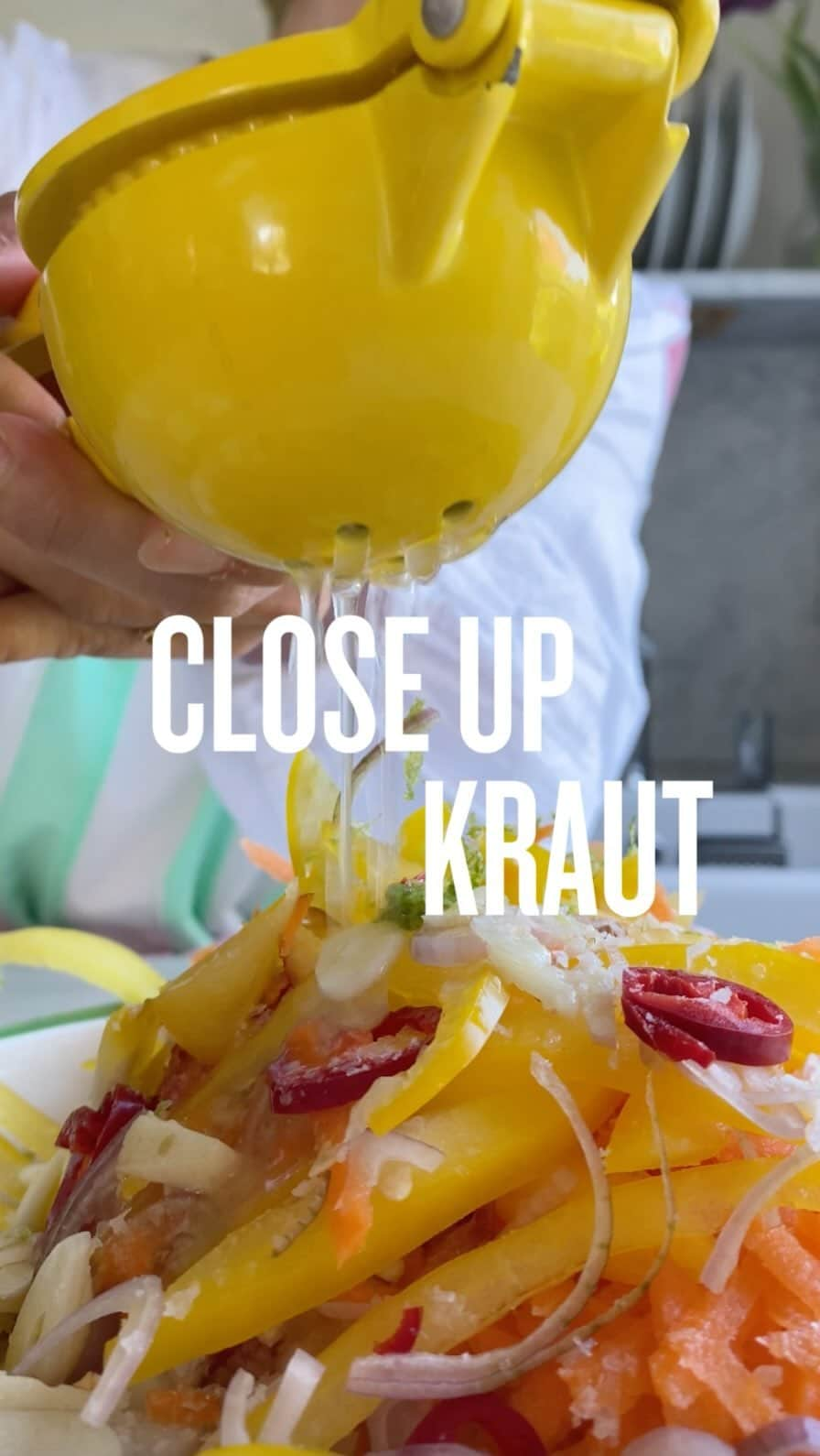 レイチェル・クーのインスタグラム：「Kraut close up 👀  Here you can see why I’ve called it a rainbow kraut, I’ve tried to get as many colours in here as possible 🌈   This kraut is loosely based on the Haitian pickliz (pick-lees) but with a bit less spice and vinegar to give more tang.  ✨ Top tip: the longer you leave a pickle, the more mellow the flavours become overtime. So, if you want it less spicy, leave it in your fridge for a little longer!   👉🏻 Head to my page to see more on this beautiful rainbow kraut, and get access to the complete recipe by clicking the link in my bio 🤩  #rknews  Gifts: Shirt @emilyandfin Apron @polkapants_ (gift) Lipstick @hourglasscosmetics My icon is」