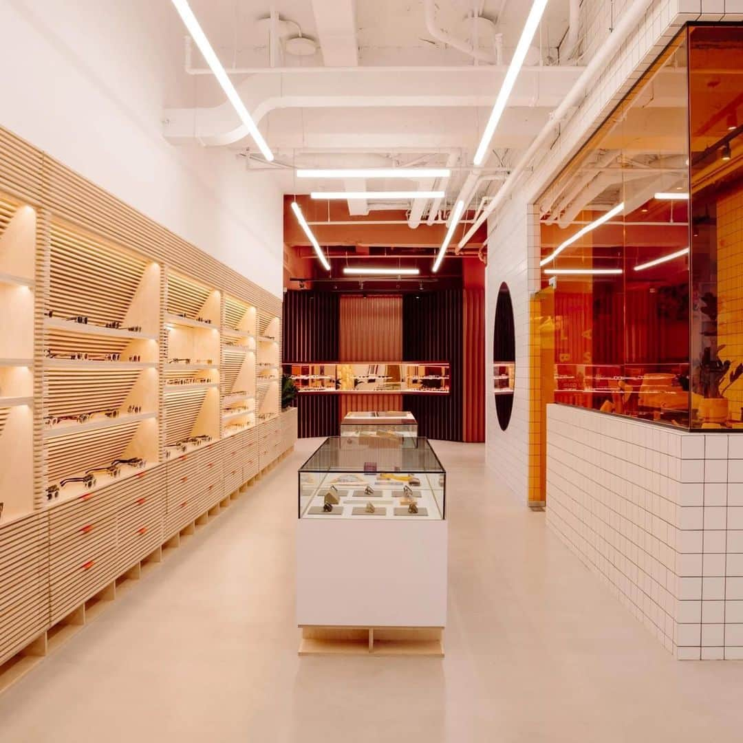 ジーエルシーオーのインスタグラム：「Have you visited our new New York store on Mulberry? We won an award thanks to @dezeen   This project has been longlisted in the retail interior (small) category of Dezeen Awards 2023.  Studio: West of West Project: Garrett Leight New York  West of West has conceptualised the Garrett Leight store in New York, United States.  "We envisioned Garrett Leight California Optical New York as a utilitarian space inspired by the contrasting, multifaceted cultural and urban landscape of New York," said West of West.  The ongoing history of the store's context connects the legacy of the surrounding neighbourhood to GLCO.  Located on mid-block on a busy street the space contains a series of different elements, each unique and distinct, like a small city block. These elements functionally display products, provide atmosphere, and broadcast the GLCO brand.  "The design takes core parts of the GLCO brand language and re-casts them to reflect the time and place of the new location," added West of West.」