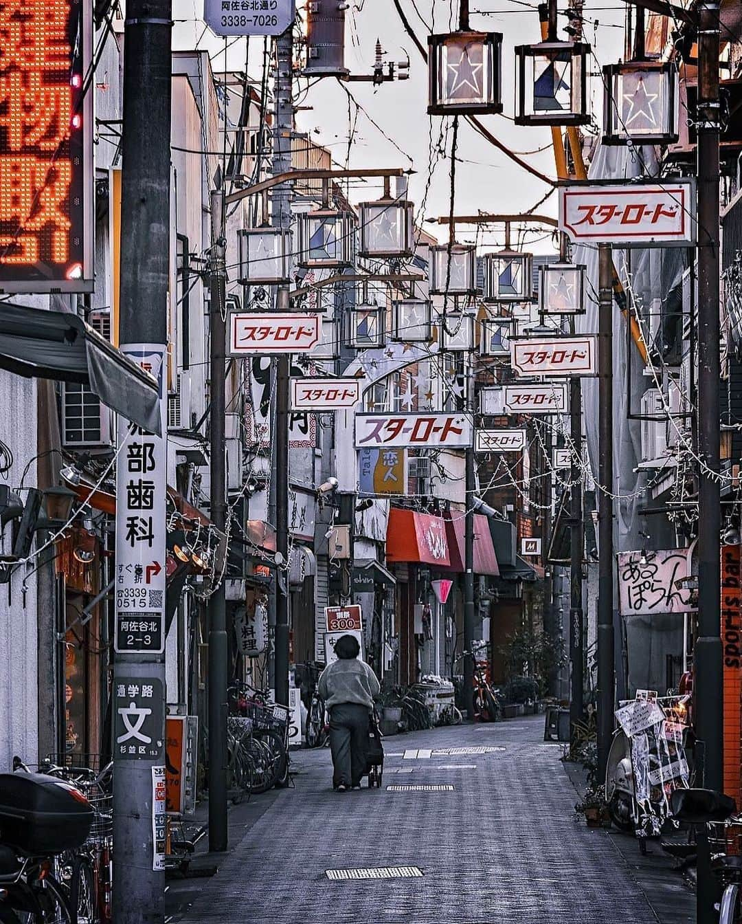 Promoting Tokyo Culture都庁文化振興部のインスタグラム：「The "Star Road Shopping Street" in Asagaya leaves a striking impression with its star-themed streetlights and the name "Star Road" in Japanese illuminated ⭐️  Asagaya has a rich history as a gathering spot for writers, musicians, and other cultural icons, earning a reputation as a place where various music genres, notably jazz, have thrived.  This long and narrow alley features approximately 150 small, unique stores that have been cherished by the neighbourhood community for many years.  星のモチーフが付いた街灯と「スターロード」の文字が印象的な、阿佐ヶ谷の「スターロード商店街」⭐️ 阿佐ヶ谷は、古くから文人や音楽家など多くの文化人たちが集い、ジャズをはじめとした音楽の根付く街としても知られています。 この細長い路地には、そんな街の人々に長年親しまれてきた、個性の光る約150の小さなお店が軒を連ねます。  #tokyoartsandculture 📸: @funky_side_of_town  #asagaya #阿佐ヶ谷 #スターロード商店街 #tokyotrip #tokyostreet #tokyophotography #tokyojapan  #tokyotokyo #culturetrip #explorejpn #japan_of_insta #japan_art_photography #japan_great_view #theculturetrip #japantrip #bestphoto_japan #thestreetphotographyhub  #nipponpic #japan_photo_now #tokyolife #discoverjapan #japanfocus #japanesestyle #unknownjapan #streetclassics #timeless_streets  #streetsnap #artphoto」