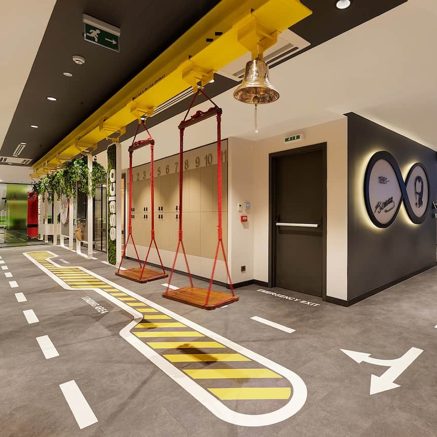 Design Milkのインスタグラム：「We love working remote, but this is an office we could get on board with! 👀  @osoarchitecture was tasked with designing a new office for a staff of 70 young + dynamic employees at Esalco Logistics, and they delivered! The space is brought to life with playful colors + nods to logistics throughout. From shipping container-inspired front desks to swings + road markings, it's an office that is clearly not "all work and no play".   Explore it more at the link in bio! 🔗  📸 Photography by @gurkanakay.  [interior design, office design, commercial design, office interior, workplace, workspace, modern design]」