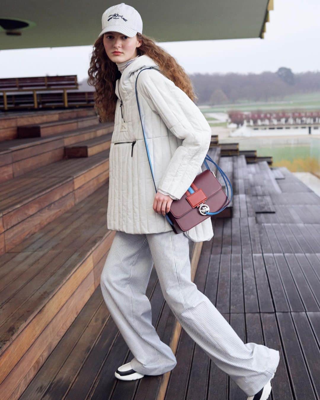 Longchampのインスタグラム：「Ready? Go!  Collection: #LongchampFW23 Bag: #LongchampBoxTrot Ready-to-wear: @longchamp  Photographer: @gregoire_avenel Model: @ilse.rood   #longchamp #newcollection #backtoshcool #longchampgirls #ootd #outfit #horseracing #whitelook #bicolor #handbag #frenchy」
