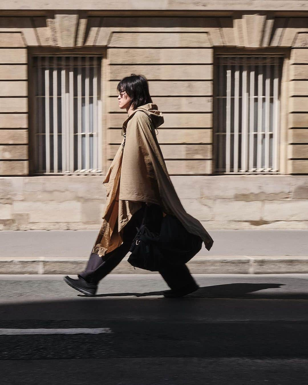 コートエシエルのインスタグラム：「The OBION “Raven” from Fall/Winter ‘23  Shot on location in Paris, the OBION in its “Raven” fabrication provides a stark contrast to the glowing sandstone hue of the nearby buildings.   Photographer/Stylist: @graemegaughan」