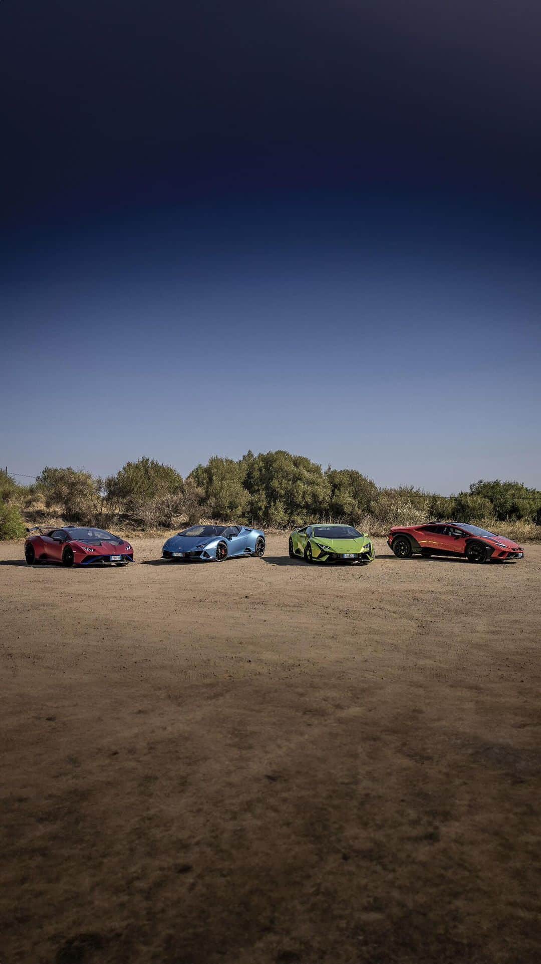 ランボルギーニのインスタグラム：「Ultimate drive. Ultimate location.    The wild and windy landscapes of the rugged island of Sardinia are the perfect setting to showcase the different souls of the V10 Lamborghini Super Sports Car line-up. The Lamborghini Huracán Evo Spyder, STO, Tecnica and Sterrato set out together for the first time, beginning their adventure at the Lounge Porto Cervo through Costa Smeralda.    #Lamborghini  __  Huracán EVO Spyder: fuel consumption combined 14.2 l/100km; CO2-emissions combined 338 g/km (WLTP EU27)    Huracán STO: fuel consumption combined 13.9 l/100km; CO2-emissions combined 331 g/km (WLTP EU27)    Huracán Tecnica: fuel consumption combined: 14,5 l/100km (WLTP); CO2-emissions combined: 328 g/km (WLTP)    Huracán Sterrato: fuel consumption combined: 14,9 l/100km (WLTP); CO2-emissions combined: 337 g/km (WLTP)」