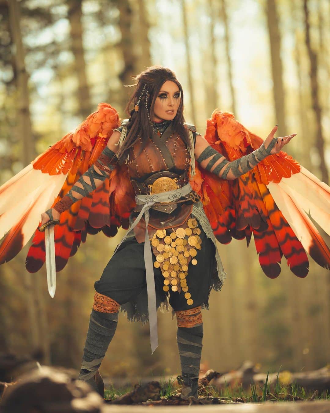Jessica Nigriさんのインスタグラム写真 - (Jessica NigriInstagram)「Freya from God of War Ragnarok!  WHICH ONE DO YOU PREFER?? LEMME KNOW   ARRRGGH THIS IS EASILY ONE OF MY FAVORITE SHOOTS TO DATE AND I CANT WAIT TO SHARE MORE WITH YOU  Photos: @martinwongphoto  Costume made by me!  Wig: @bindismalls  Wings @thecrookedfeather  Gold bits + tattoos @habiteer_workshop  Blades of Chaos: @sksprops」9月16日 6時44分 - jessicanigri
