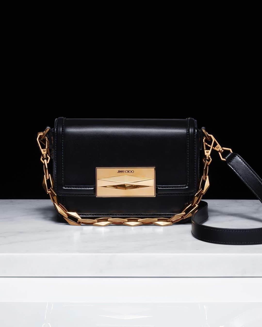 Jimmy Chooのインスタグラム：「Defined by sumptuous Italian leather and meticulously crafted Diamond hardware, the Diamond Crossbody is a testament to design excellence and time-honoured skill. #JimmyChoo」
