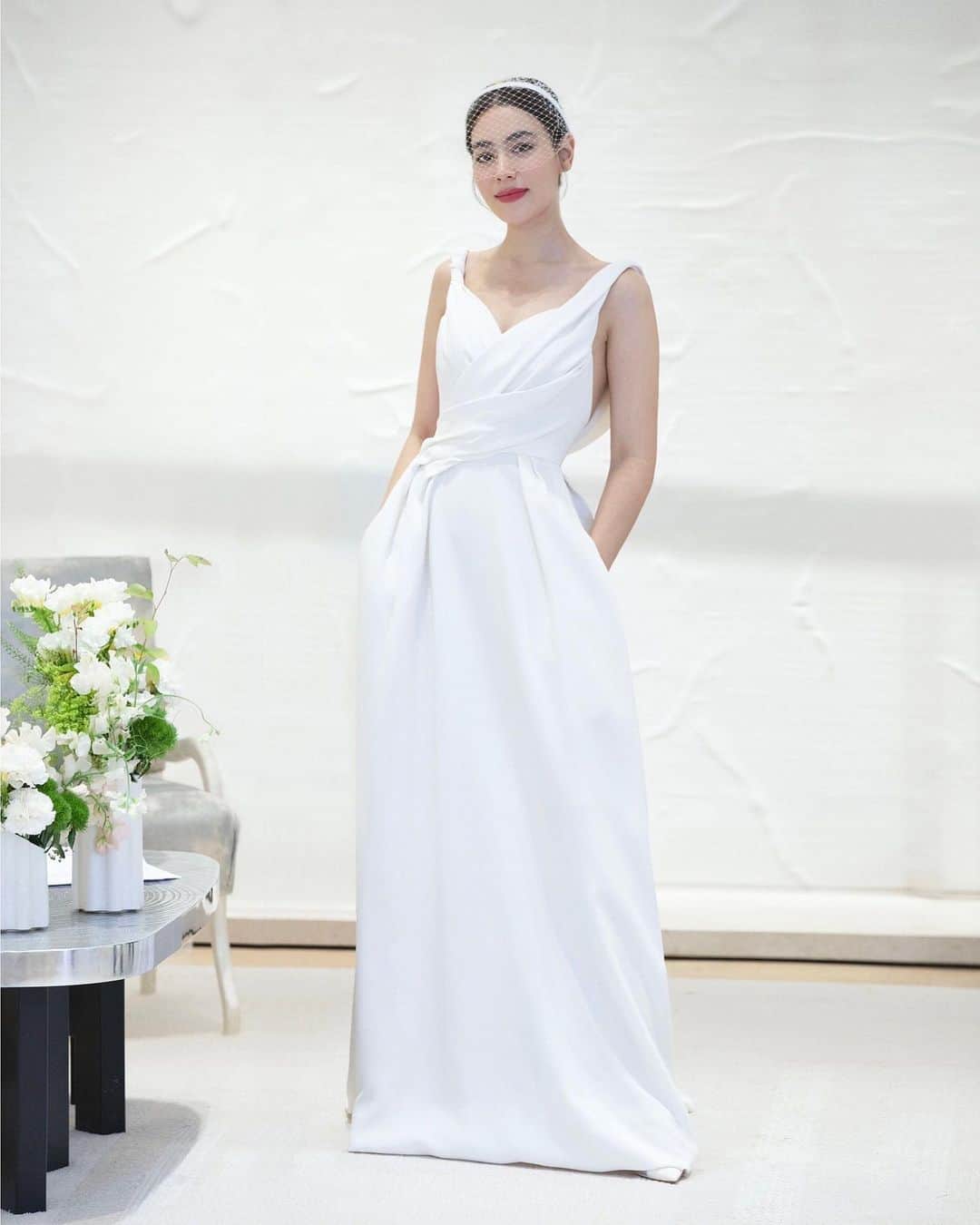 キンバリー・アン・ウォーテマス・ティアムシリのインスタグラム：「Amid an ambiance of pure elegance and heightened anticipation, a dream transformed into a reality as Thai ambassador @Kimmy_Kimberley donned each of her tailor-made wedding dresses designed by @MariaGraziaChiuri. Each unique creation stands as a masterpiece in its own right, whether it be the irresistibly airy gown, the dress with a refined pleated neckline and contemporary waistline, or the majestic ensemble entirely adorned with ethereal floral lace. ©️ Sophie Carre」