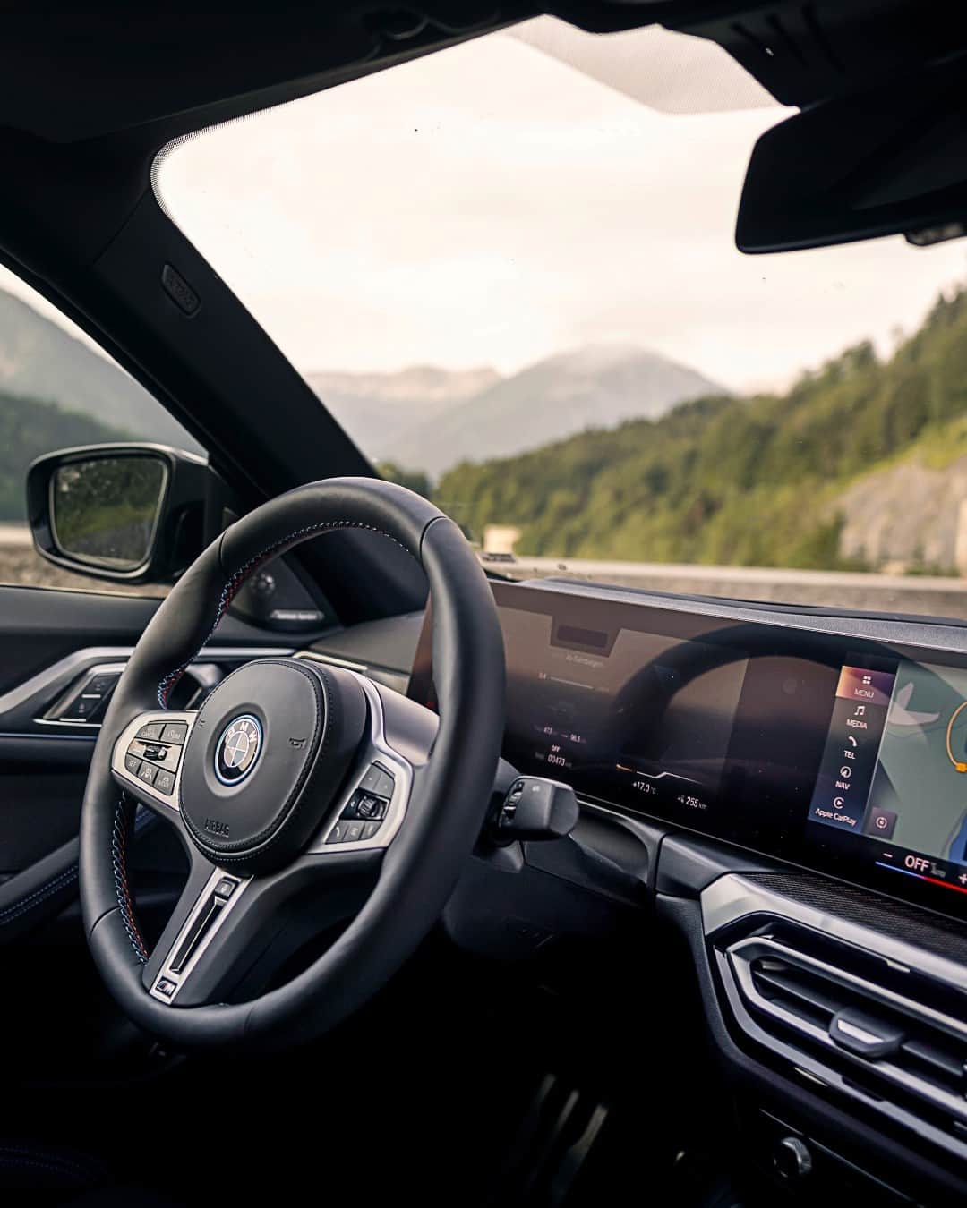 BMWのインスタグラム：「Living above the trees ☁️  The BMW i4 M50. #THEi4 #BMW #BornElectric #BMWElectric #BMWM #MPerformance __ BMW i4 M50: Combined power consumption: 22.6–18.0 kWh/100 km. Combined CO2 emissions: 0 g/km. Electric range: 414–520 kilometers. All data according to WLTP. Further info: www.bmw.com/disclaimer」