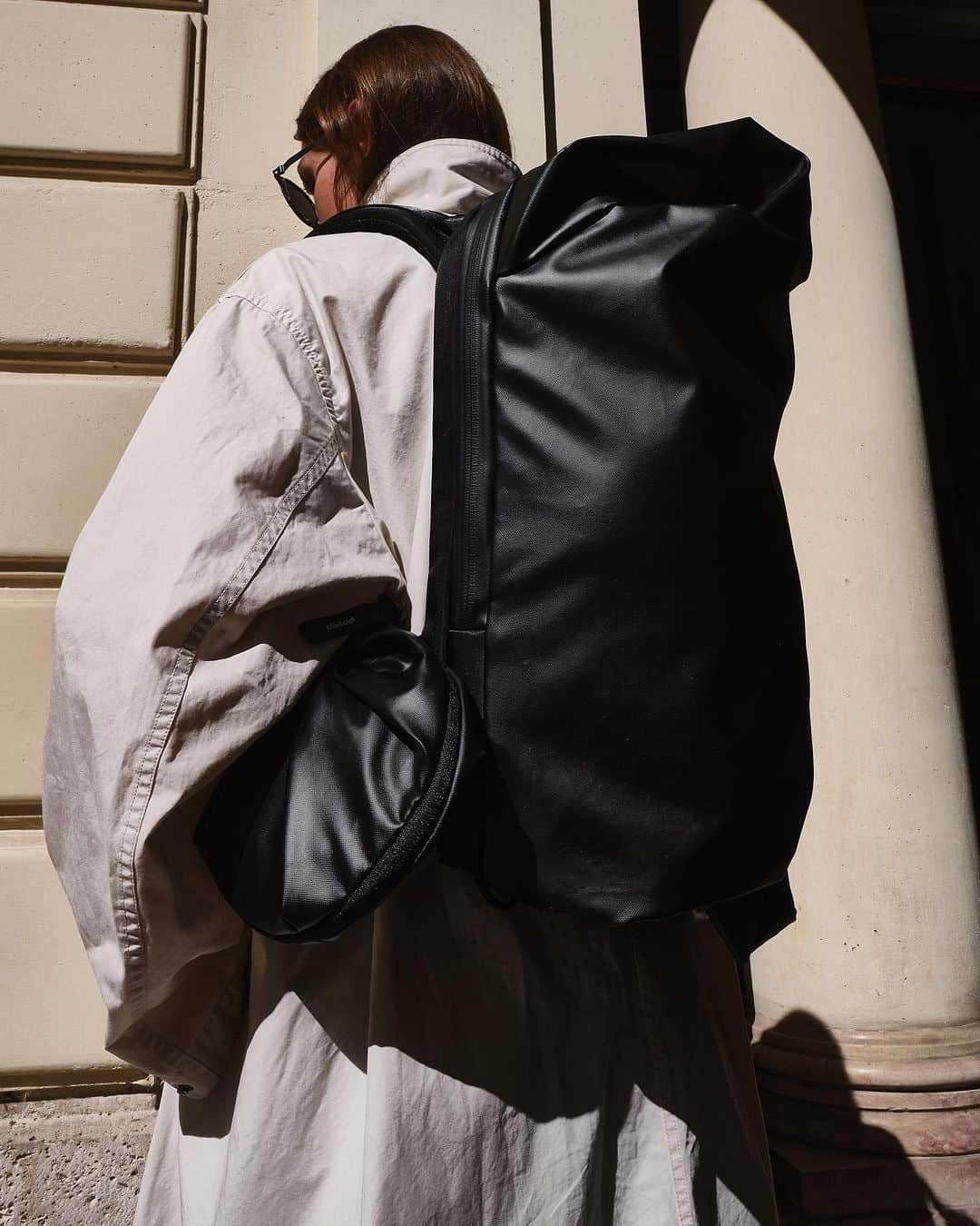 コートエシエルのインスタグラム：「The LADON is one of they key styles presented in our Fall/Winter ‘23 editorial, shot in Paris as an homage to côte&ciel’s spiritual home.   Playing with the natural light and embracing the innate textures provided by the sandstone buildings with their glowing hue, this editorial sought to capture the essence of the city in day-to-day nature  The chosen Fall/Winter ‘23 styles seamlessly interacted with their surroundings, immersing themselves in an environment that is unmistakably Paris without the usual hallmarks. Photographer/Stylist: @graemegaughan」