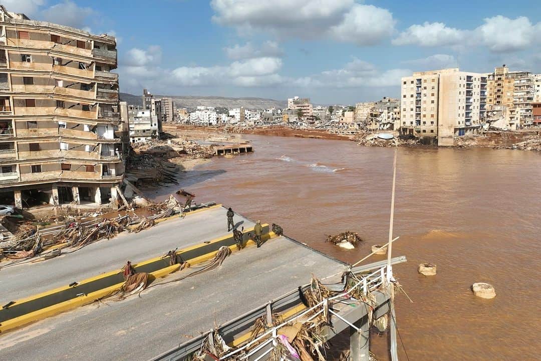 TIME Magazineのインスタグラム：「At least 11,300 are dead and more than 10,000 missing in Libya after devastating floods swept through the city of Derna.  Here, photographs from the disaster that include images of the flooding caused by Storm Daniel, people scanning the list of missing people, and a boy pulling a suitcase past debris in a flash-flood damaged area.  Link in bio.  Photographs by Jamal Alkomaty—AP; Esam Omran Al-Fetori—Reuters; AFP/Getty Images」