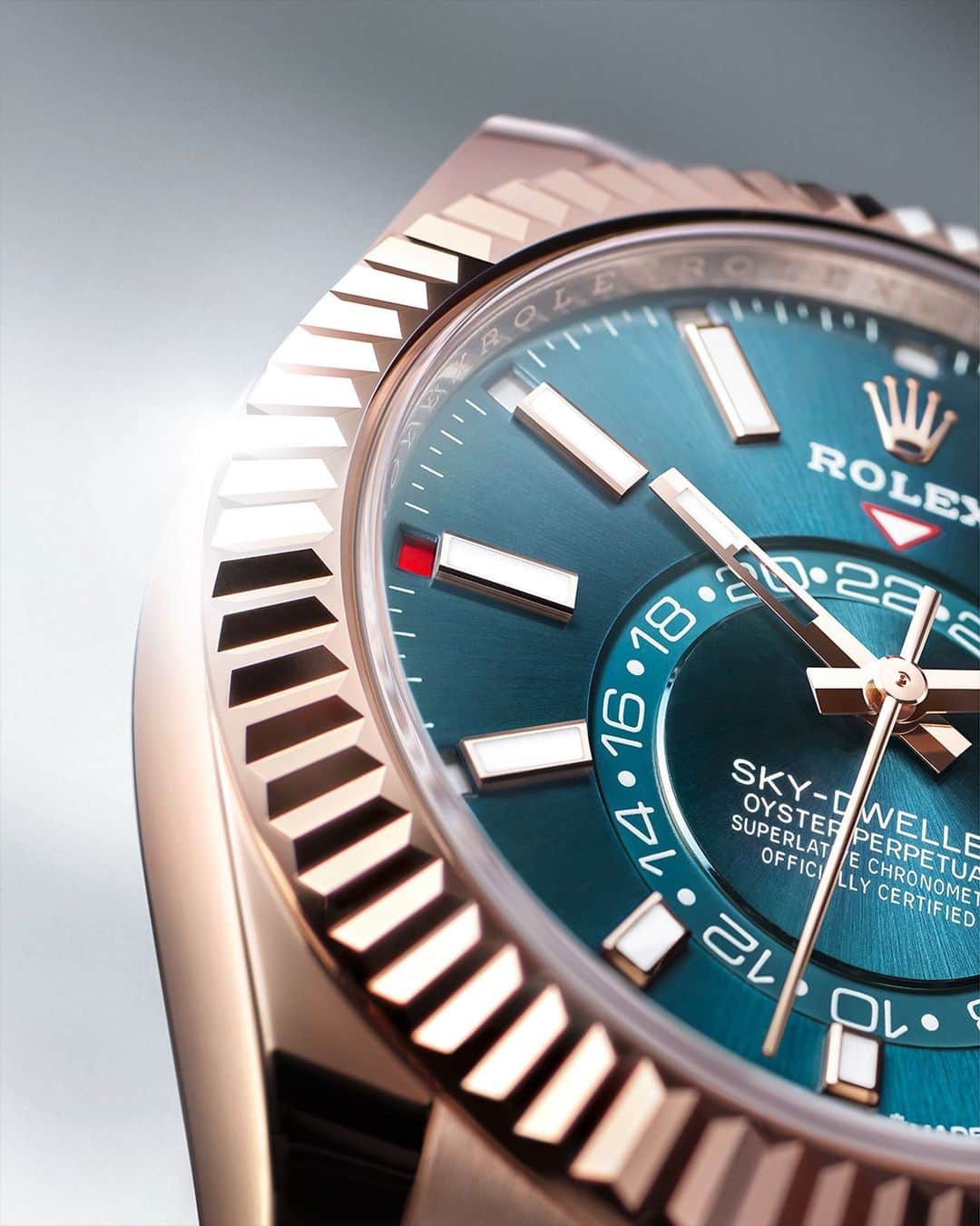 rolexのインスタグラム：「The Sky-Dweller in 18ct Everose gold with a blue-green dial. Its Saros annual calendar displays the months of the year in the most ingenious way: 12 discreet apertures around the circumference of the dial, with the current month indicated in red. #Rolex #SkyDweller #Perpetual」