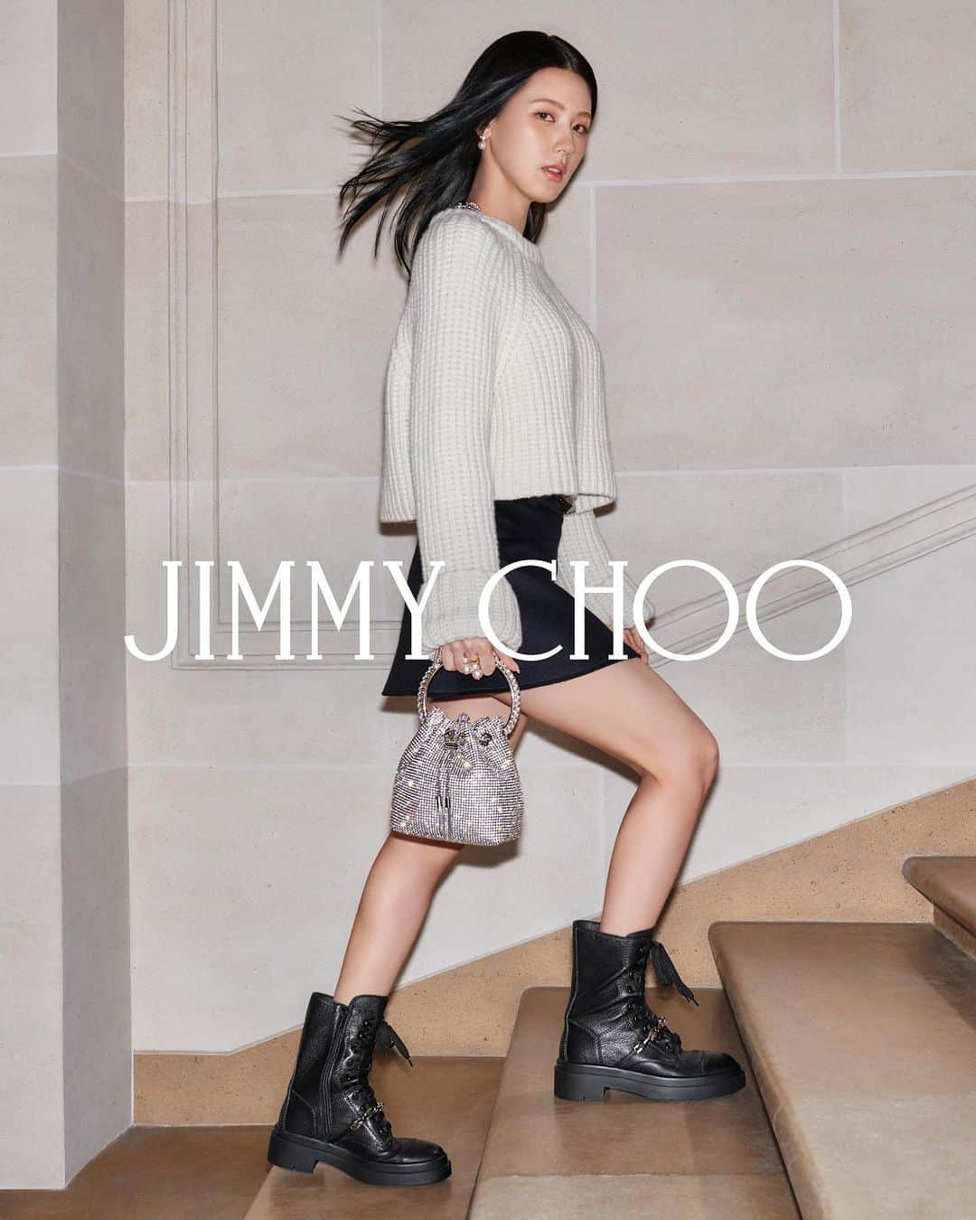 Jimmy Chooのインスタグラム：「Take your style cues from Global Brand Ambassador @noodle.zip and double down on statement shoes and accessories - the iconic Crystal Bon Bon and Nari combat boots make for a playful mix. #JimmyChoo」