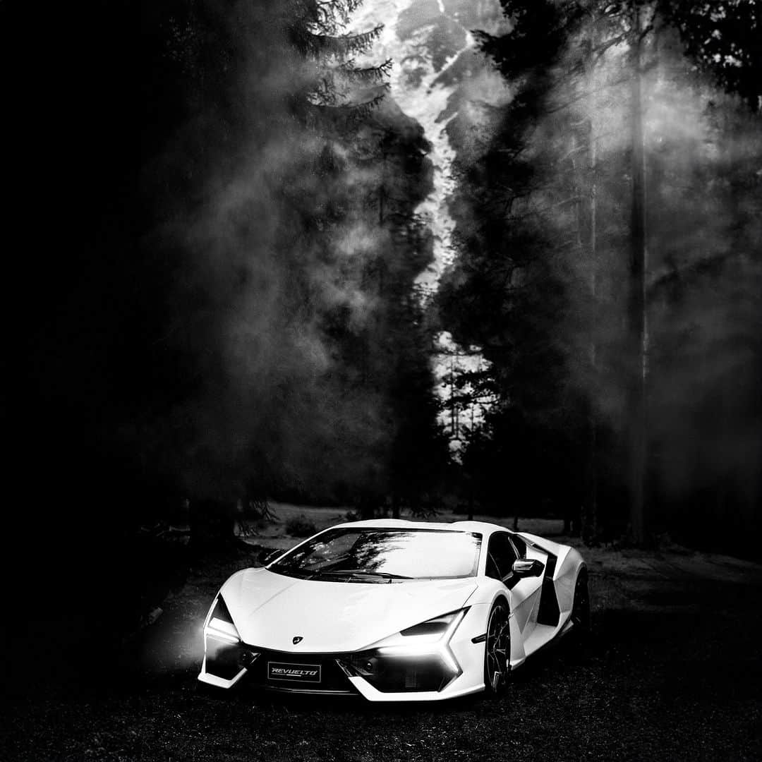 ランボルギーニのインスタグラム：「He’s worked with the greatest names in music and the arts – now legendary photographer @antoncorbijn4real turns the Lamborghini Revuelto into a rock star.   For Corbijn, forging a personal connection with the subject is everything. He works fast, and remains true to the values embodied by Lamborghini itself: going beyond, with bravery and authenticity.   Experience the essence of this approach in Revuelto’s shots in the breathtaking Dolomites.  Watch the interview on YouTube!  #Lamborghini #DrivingHumansBeyond  __ The vehicle is not yet offered for sale and is therefore not subject to Directive 1999/94/EC. The fuel consumption and emissions data is in the type approval stage」