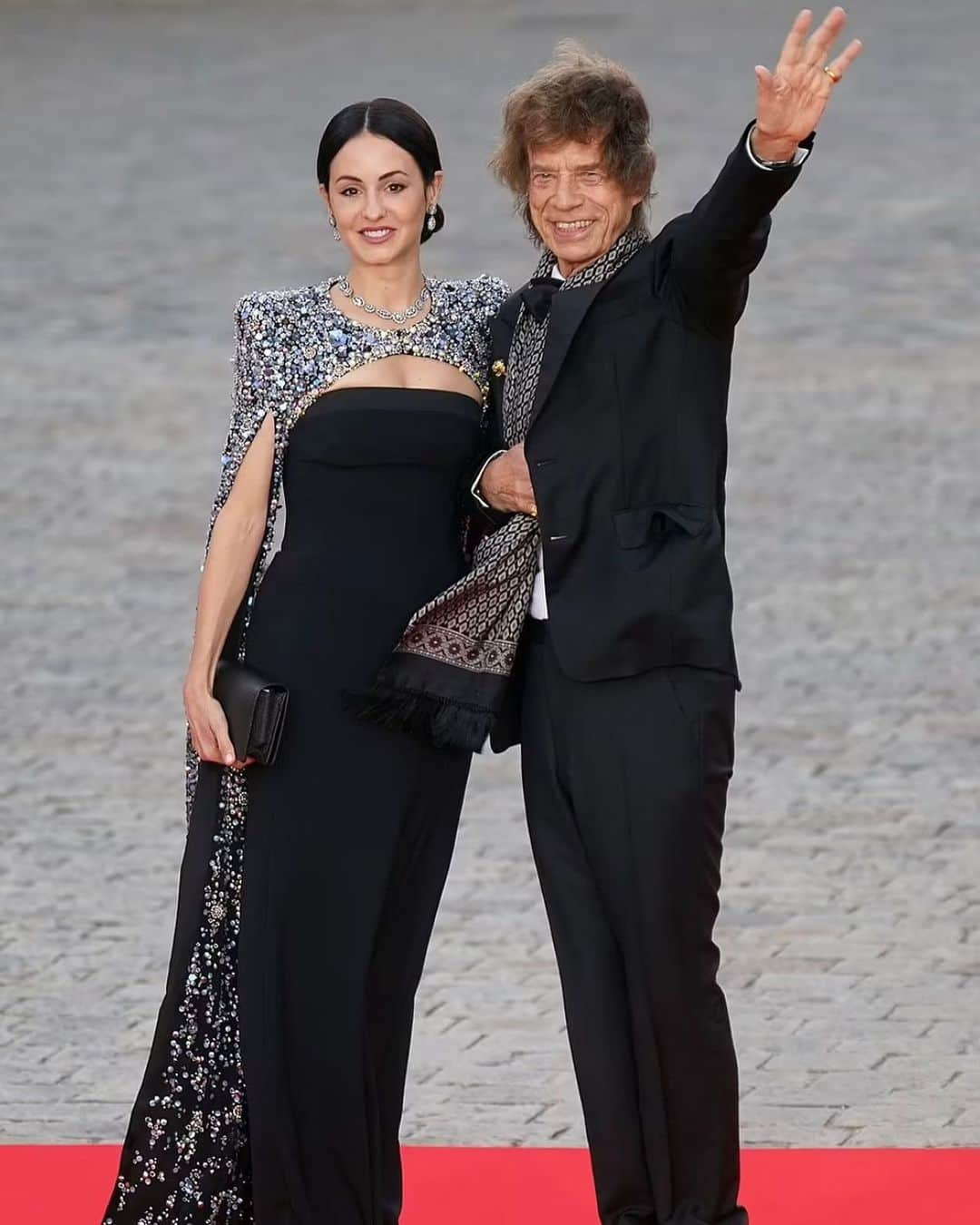 ジェニーパッカムのインスタグラム：「Versailles, France. Mick Jagger with Melanie Hamrick wearing Jenny Packham at the Versailles State Banquet.  #jennypackham #mickjagger #versailles #france #style #versaillespalace #melaniehamrick」