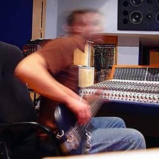 MUSEのインスタグラム：「Pictured: Chris playing so fast the camera can't keep up with him. Shot during the recording of Absolution at Grouse Lodge, Ireland in 2003. Any guesses which song he was playing? Let us know 👇🏻  Pre-order the new Absolution anniversary boxset at the link in bio.」