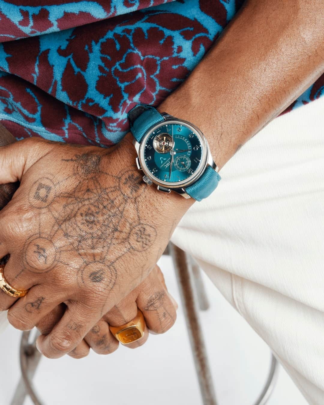 IWCさんのインスタグラム写真 - (IWCInstagram)「Aesthetically bold. Mechanically complex.  This vibrant aesthetic has been personified in our third collaboration with the Portugieser Tourbillon Rétrograde Chronograph Lewis Hamilton (Ref. IW394008). Combining exceptional watchmaking technology with a striking design, this timepiece has a refined 43.5 mm platinum case and vibrant teal dial embellished with 12 diamonds and features a panther's eye – the logo of the seven-time F1™ world champion. The IWC-manufactured 89900 calibre drives a flying hacking minute tourbillon, retrograde date display and a flyback chronograph. The flow of energy in the movement is improved thanks to the so-called Diamond Shell® technology on the pallet lever and escape wheel, contributing to a power reserve of 68 hours. This timepiece is limited to 44 pieces, reflecting the number Hamilton has raced with since the beginning of his career.  #IWCportugieser I #TheReference | #LewisHamilton  🔗Link in Bio」9月22日 3時00分 - iwcwatches