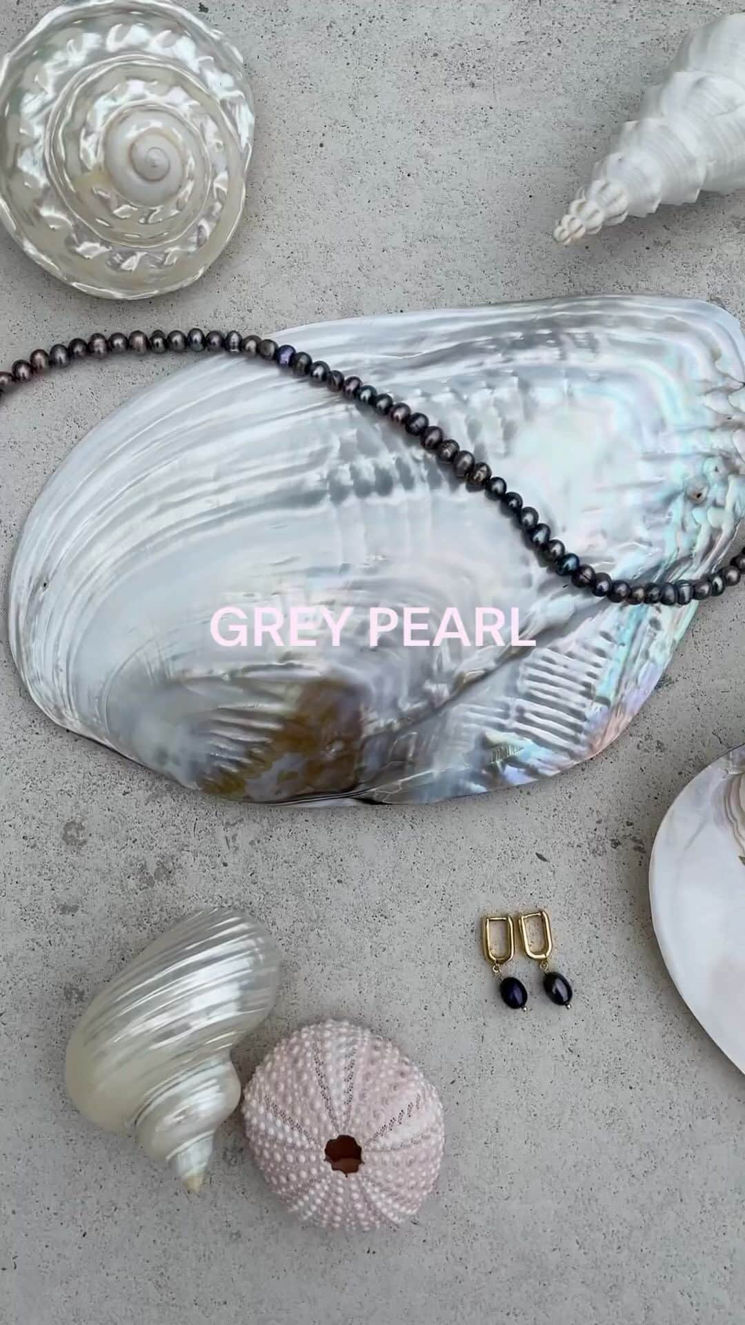 のインスタグラム：「Wave 👋 hello to the mother of all pearls with our new Grey Pearl collection. ⁠ ⁠ A chromatic twist on a timeless classic, we’ve paired them with genuine 14ct-gold plating for pieces you’ll never want to take off. Wear them to tap into your inner wisdom, and put a serene spin on your autumn jewellery rotation.⁠ ⁠ 🔍️ Ring - 69443835⁠ 🔍️ Pearl Round Necklace -  6823763500⁠ 🔍️ Pearl Huggie Hoops - 6814743500⁠ 🔍️ Threaded Pearl Earrings - 6814643500」