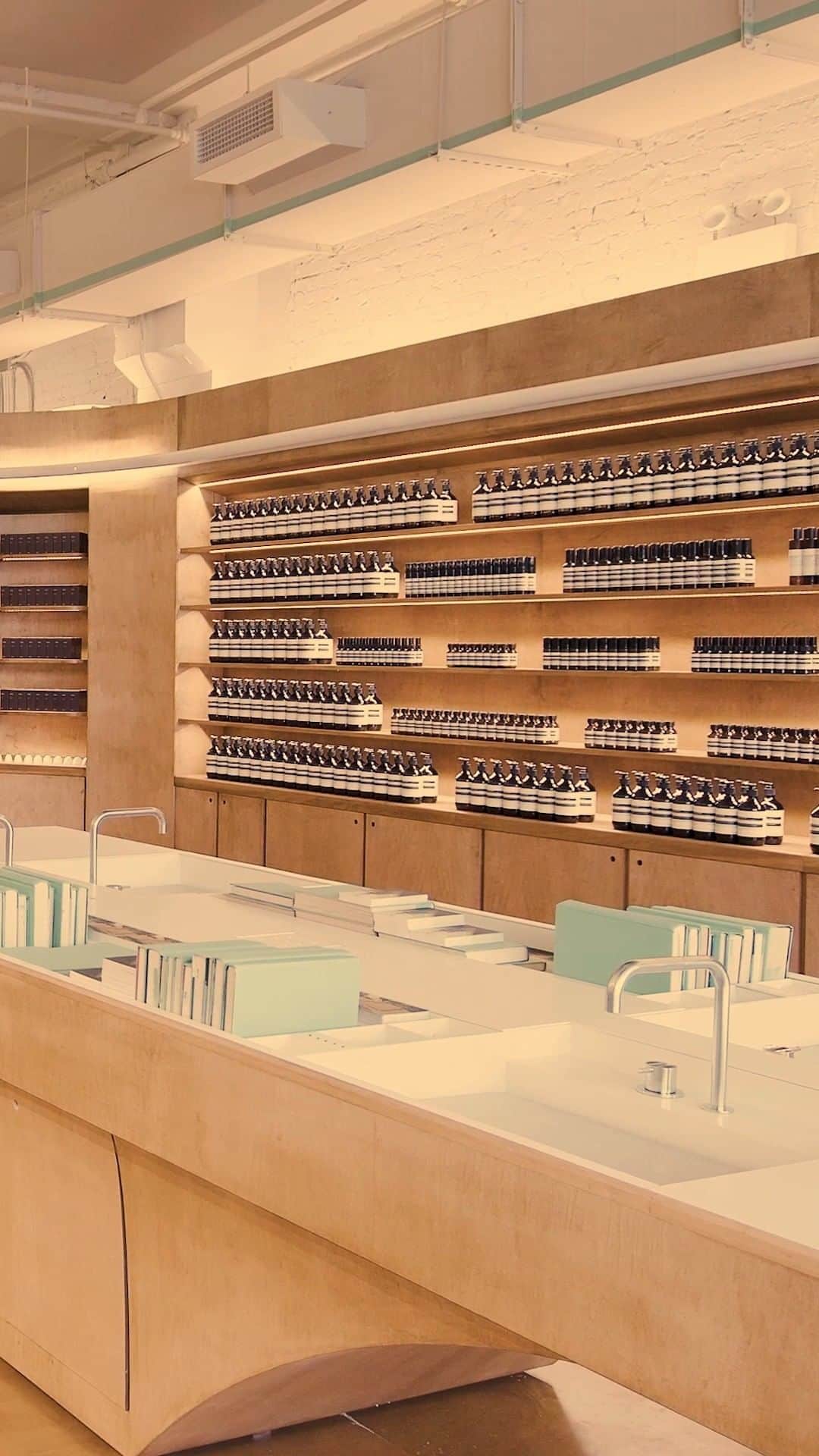 のインスタグラム：「Urban dreamscapes at Aesop Gansevoort.   Our first store in New York City’s Meatpacking District pays homage to the area’s history as an effervescent urban canvas for artists. Above our customary rows of amber bottles, an exhibition of images by French photographer @romainlaprade urges eyes skyward, each shot revealing how mundane moments—seen in just the right light—can become sublime.   Architecture by Aesop’s in-house design team」