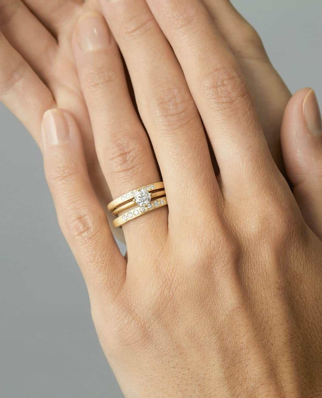 サトミ カワキタのインスタグラム：「Introducing seven alluring new styles, each thoughtfully designed to harmonize with an engagement ring, nestle gracefully among your cherished stack, or make a fun statement.⁠ ⁠ Each ring is made just for you and fashioned from textured, recycled 18K gold, and scintillating brilliant cut diamonds that shimmer like celestial stars.」