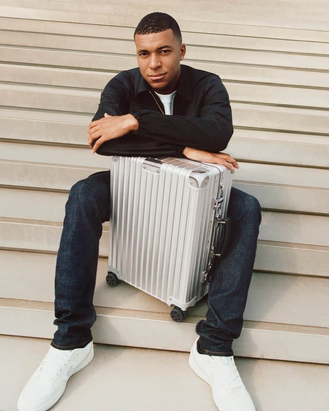 のインスタグラム：「In a world of possibilities, @k.mbappe crafts a path towards progress with the RIMOWA Classic Cabin in Silver.  Listen to the tracks that motivate the football prodigy in a new RIMOWA playlist, available via the link in bio.   #RIMOWA #NeverStill」
