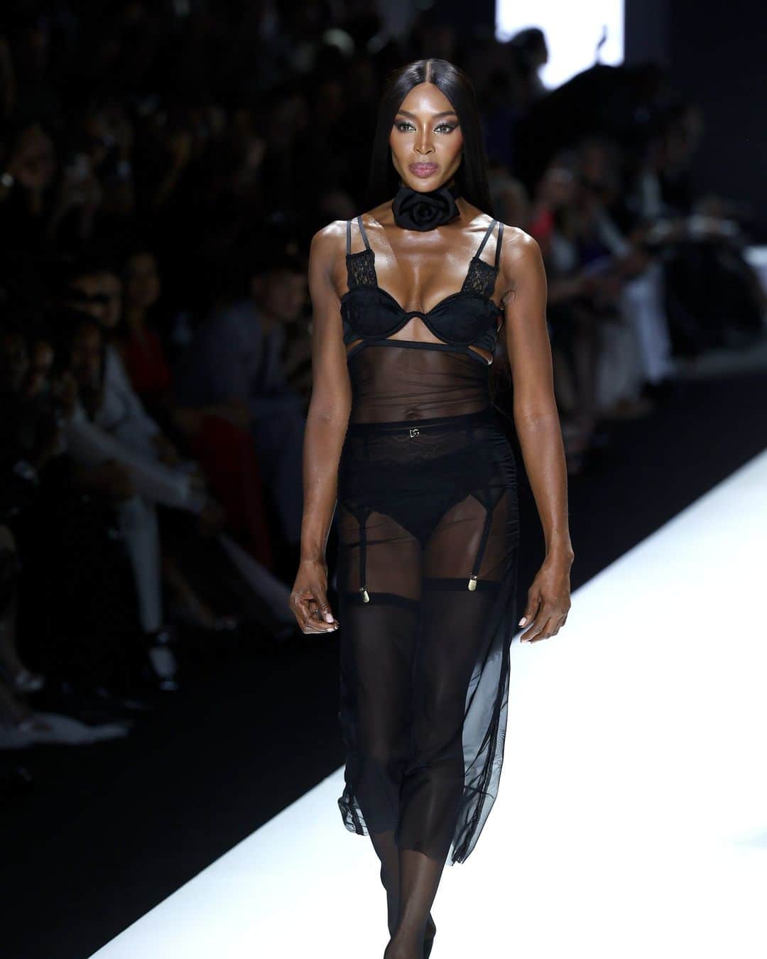 Fashion Weekのインスタグラム：「#DolceandGabbana #SS24 had something to say about the joys of getting dressed. Slashed blazers and deep-V dresses showed a triangle of mesh bra underneath. There were multiple feminine takes on the tuxedo, with black sheer minidresses bearing white bib collars. The label’s always been known for its lingerie-as-clothes, but here the looks seemed purposefully caught between.」