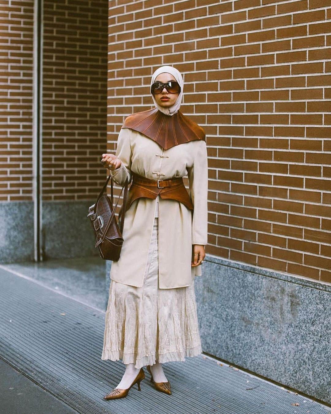 ELLE Magazineのインスタグラム：「@piermodelsjam captured some of the best street style at Milan Fashion Week. 🔥 Click the link in bio for more.」