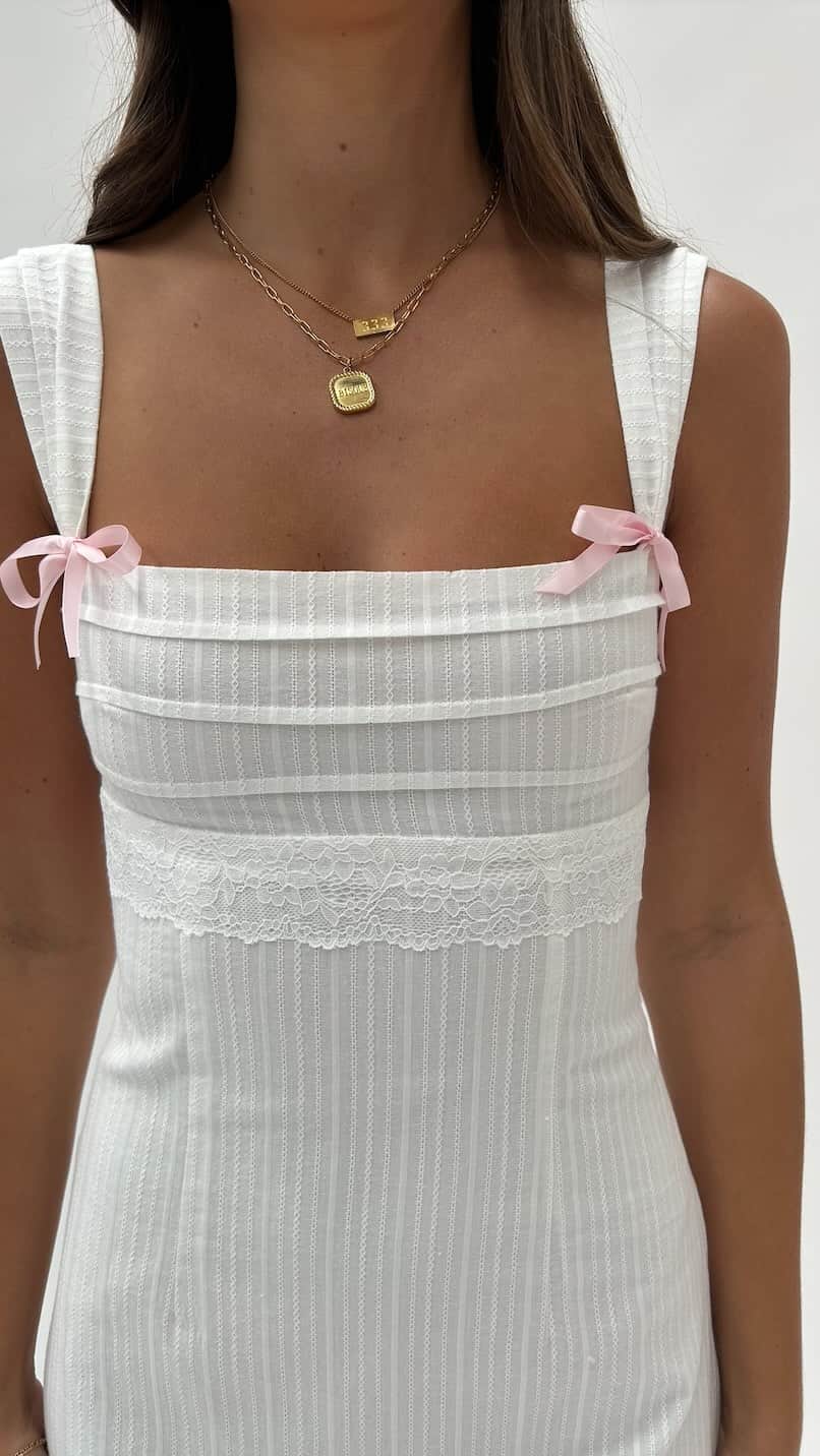 Beginning Boutiqueのインスタグラム：「The dress we can’t get enough of 🎀 Shop the RESTOCKED Taylor White Tie Back Mini Dress, online now!」