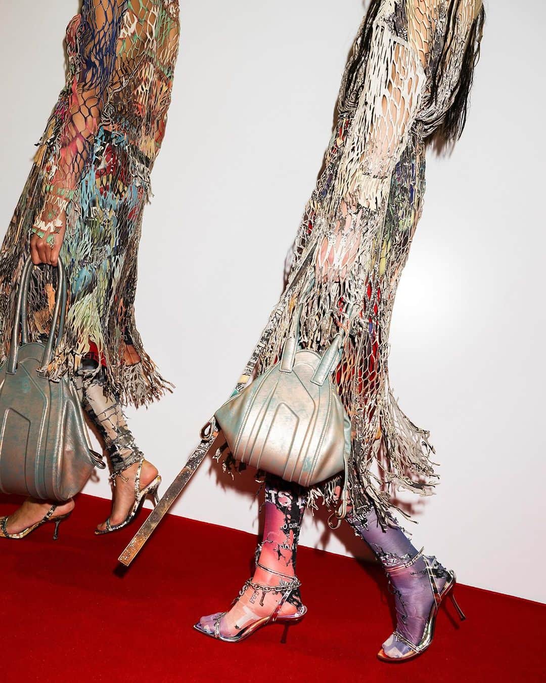 ディーゼルのインスタグラム：「Ready for our closeup.   Details from the #DieselSS24 Runway Show include the 1-DR Fold bags, round toe boots with molded Oval D hardware, Oval D denim hats and looks made out of fake Diesel Hollywood film posters.    See all the looks at the link in bio.   #ForSuccessfulLiving」