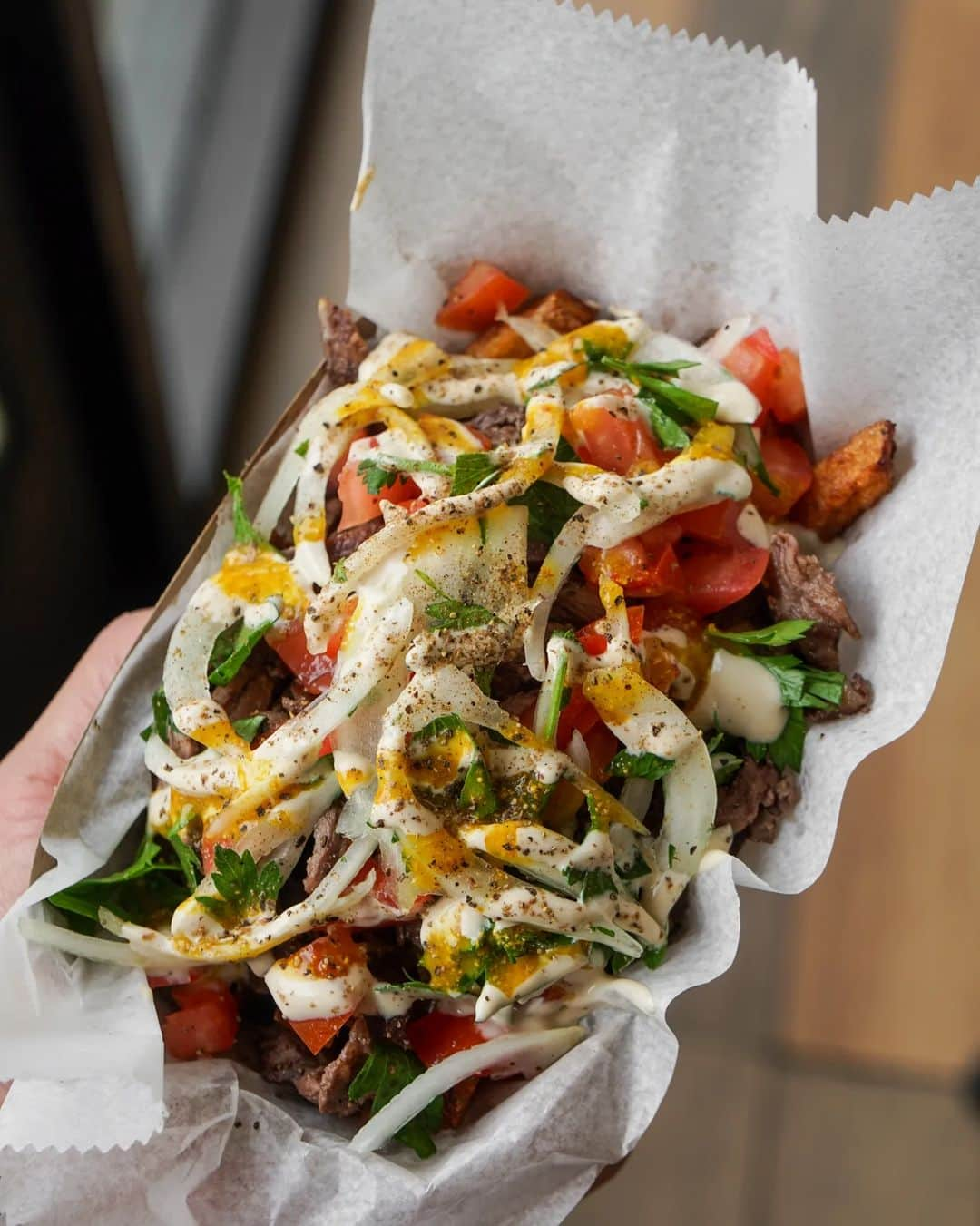 Eater LAさんのインスタグラム写真 - (Eater LAInstagram)「Shawarma is having a moment in Los Angeles, spurred on by spots in the San Fernando Valley and South Bay strip malls, specifically. It’s easy to understand why, given the ubiquity of the dish globally and its ability to pack big flavors into small bites. But there is no one in LA doing shawarma quite like Avi Cue (@avi_cue), the master of the wagyu spit. Right now, his meaty pita sandwiches may just be the best bite of food anywhere in LA.  Owner Aviad Yalin’s Studio City strip mall space — really just a light refresh of a closed Tacos 1986 location — hums during the day with chatting customers and the pulsing background sounds of feel-good Israeli music. A small line tends to form just before the doors open at noon, with diners peeking through the glass to watch the spit in action. It rotates slow and purposefully, glimmering in some places with fat and offering dark brown patches in others.  Click on the link in bio to read the story, written by Eater LA senior editor Farley Elliott (@overoverunder).   📸: @mattatouille」9月27日 7時42分 - eater_la