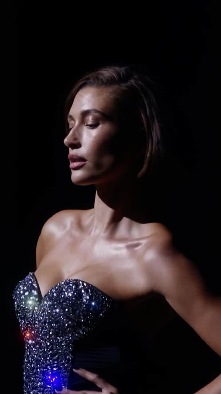 ヴィクトリアズ・シークレットのインスタグラム：「You’ve met the trailblazing #VS20 and visited four dynamic cities, but now it’s time to bring the magic home. Introducing the Tour ’23 Collection.   The road to the runway for each garment was extremely unique, from material selection, detailed sketching, and complex construction. Whether working with a legendary Swiss embroidery house or utilizing locally-sourced leather, each piece took over 60-to-80 hours to create.   In 2021, Victoria’s Secret began a journey. The goal was to give a new generation of creatives from around the world the opportunity to tell their stories and see their creations brought to life on the world stage. The platform? The Tour ’23. This film is theirs.   The VS House designs are worn by @palomjia, @eileengu, @haileybieber, @imaanhammam, @valentts, @adutakech, @candiceswanepoel, @lilyaldridge, @jilla.tequila, @gigihadid, @candicehuffine, @adrianalima, and @devynfaithgarcia.   The Tour ’23 Film:  @lolaparteloliva: Director  @ariwegner: Cinematographer  @partel.oliva: Creative Direction @pulsefilms: Production  Music Artist: @iamcobrah  Record Label: @wearebigbeat」