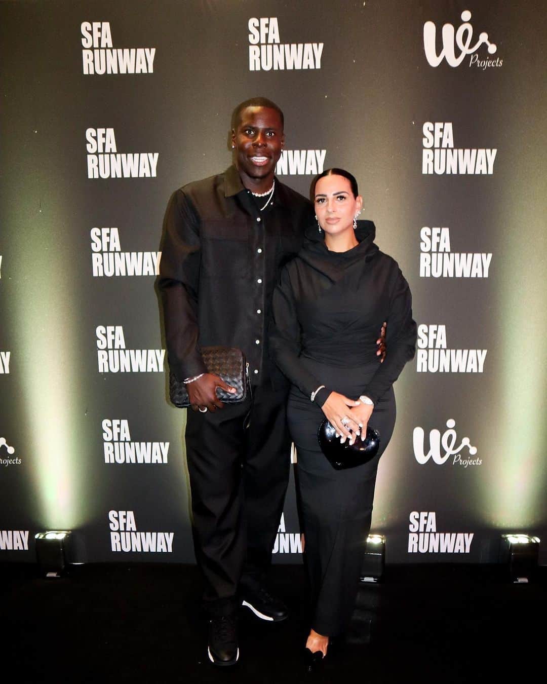 クル・ズマのインスタグラム：「London Fashion Week at the @sfarunway , Thanks Jalila for having Us it was Amazing 🤍  🪄 Styled by @yesipgnu  🪭 Mrs in full @maisonalaia  🎩 Mr in @newbottega & @chanelofficial  💎 Mrs & Mr by @mjjonesofficial」