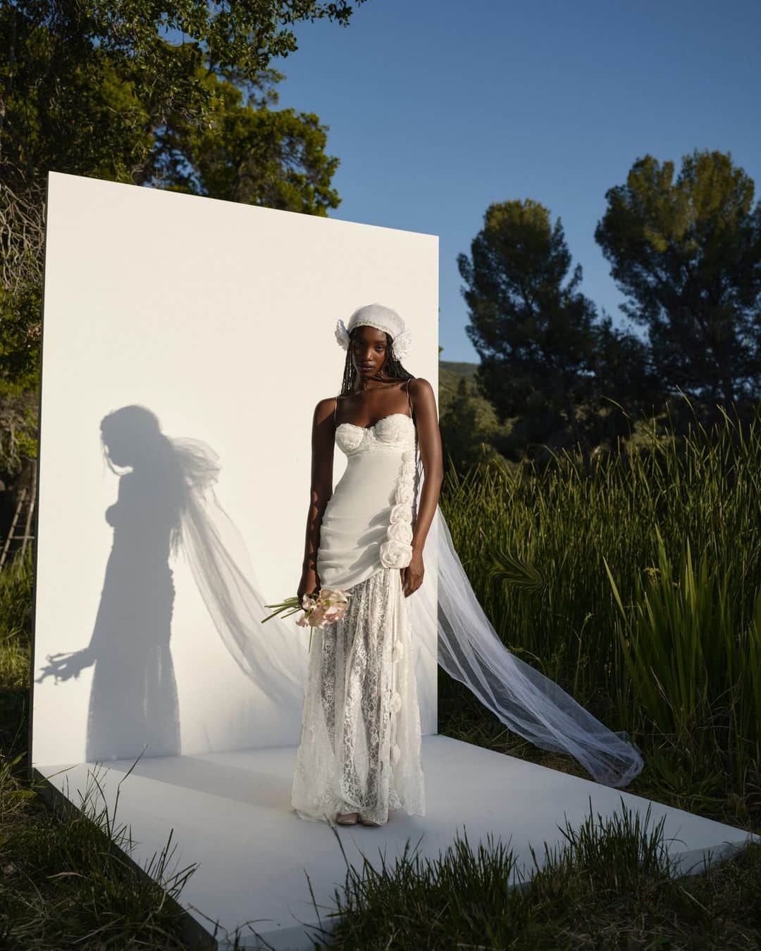 For Love & Lemonsのインスタグラム：「THE DETAILS: ethereal waterfall rosettes, cascading intricate lace cape, and a delicate leg slit ✨ The Bellany Gown #forloveandlemons」